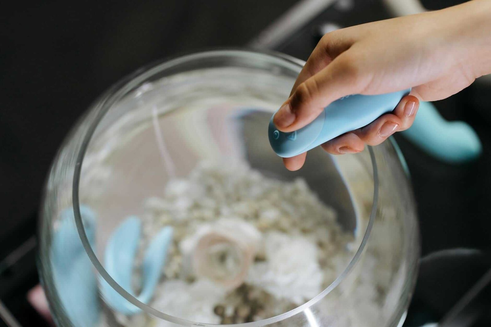 a person holding a sex toy