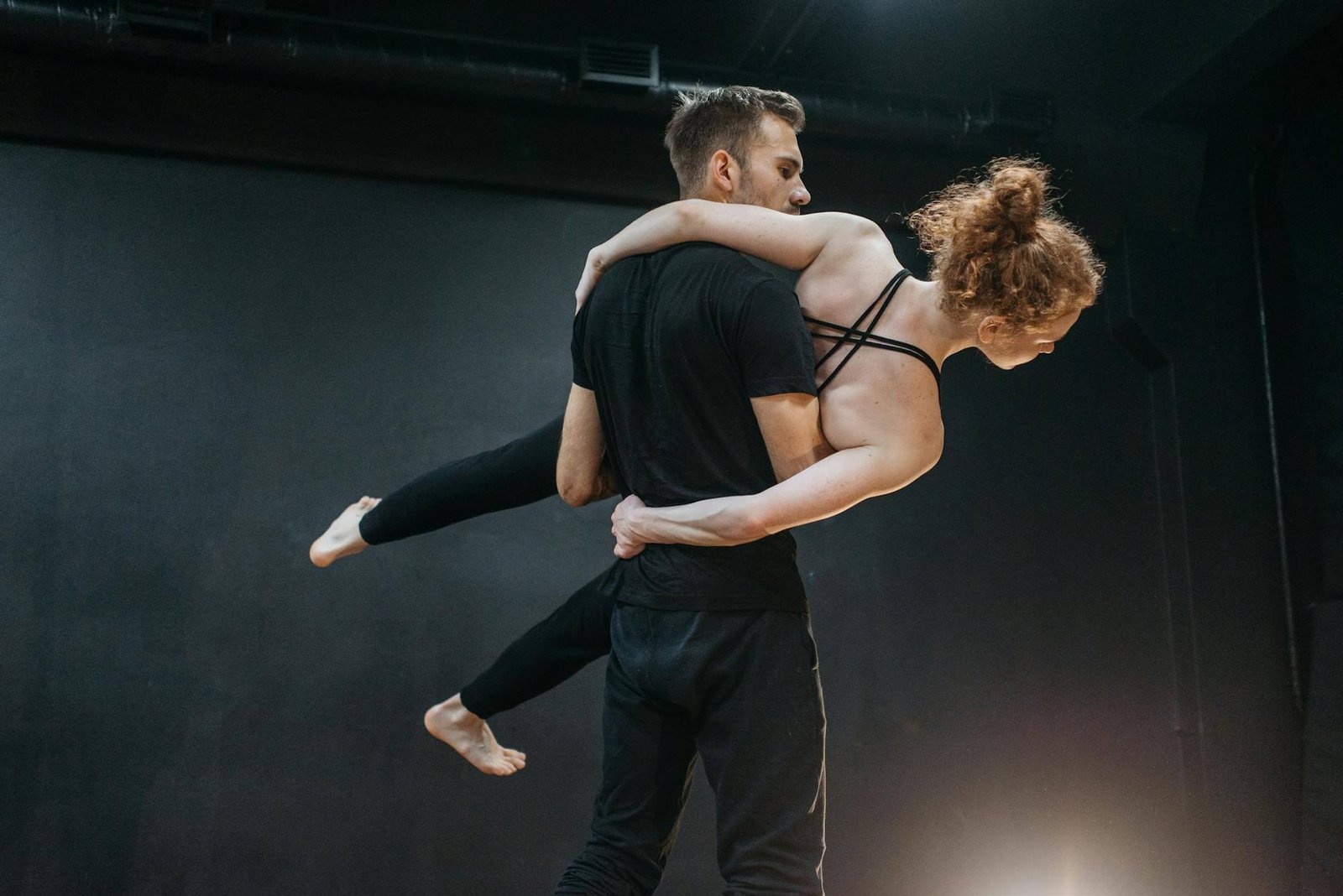 a low angle shot of a man carrying a woman